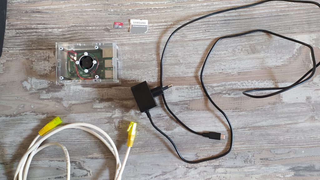 a Raspberry Pi, 4B a case, a network cable, power supply and an SD-card.